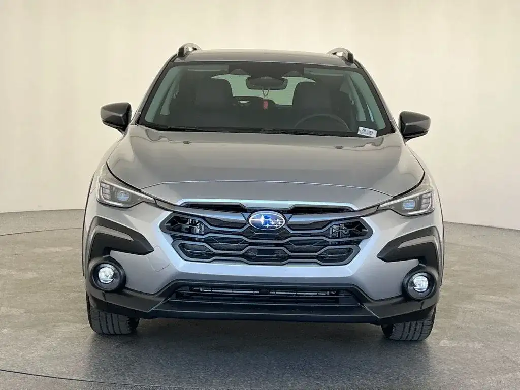 Subaru Crosstrek in grey, head-on front view showing the grille and LED headlights, photo 8 of 14