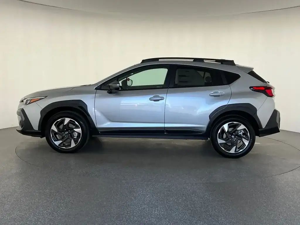 Subaru Crosstrek in silver, close view of the alloy wheel and cladding, photo 6 of 14