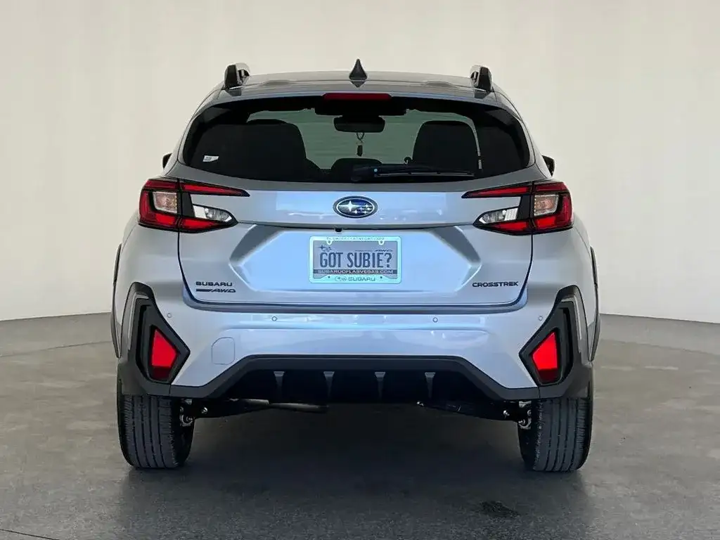 Subaru Crosstrek in silver, rear view showing the CROSSTREK and Symmetrical AWD badges, photo 4 of 14