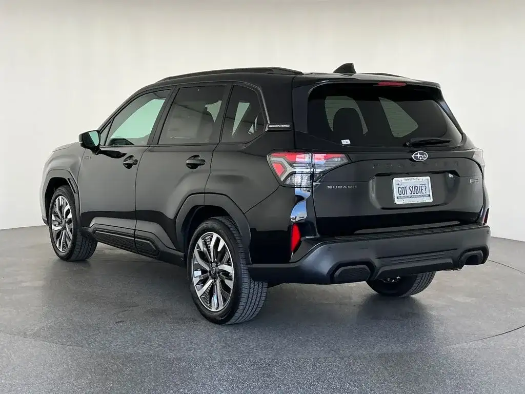Subaru Forester in black, front three-quarter from the passenger side, photo 5 of 12