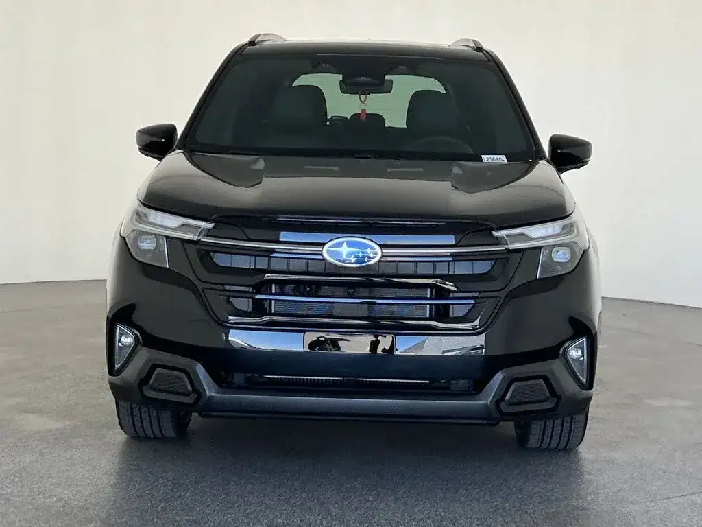Subaru Forester in black, head-on front view showing the grille, photo 8 of 12