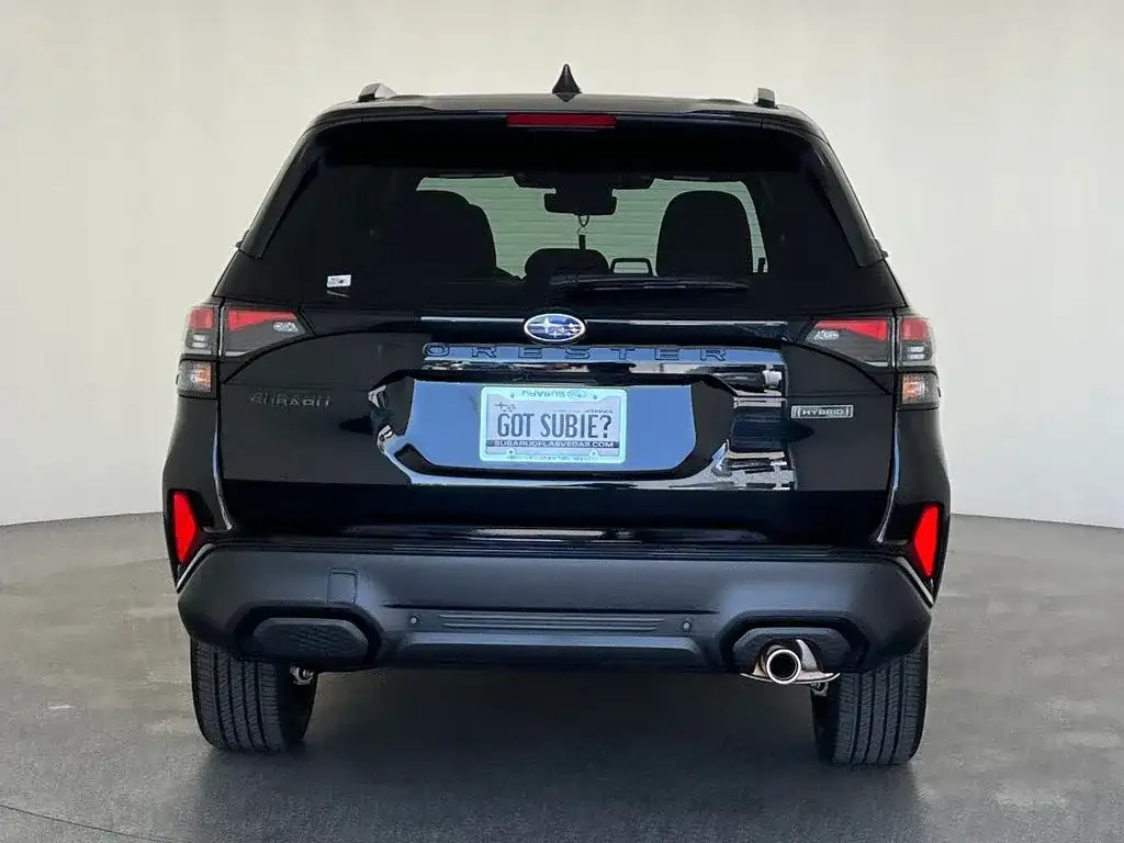 Subaru Forester in black, rear view, photo 4 of 12