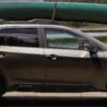 Side View of 2022 Outback Limited with Canoe on Roof
