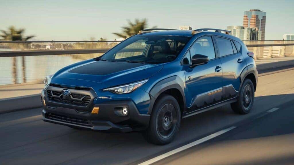 The Fabulous 2024 Subaru Crosstrek Wilderness Driving On A City Road