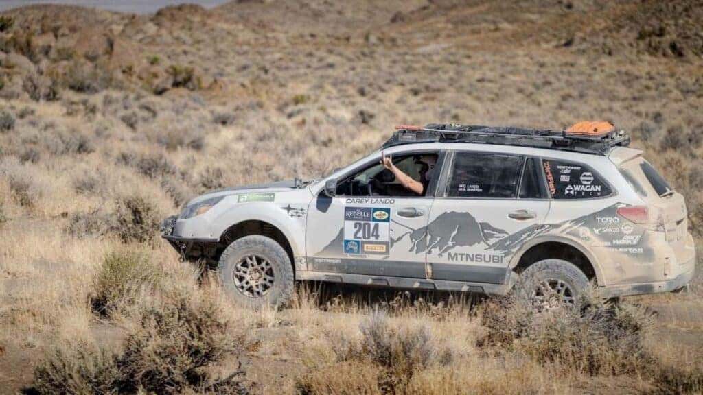 The Side Profile Of The Winning 2014 Subaru Outback, Carey Lando Signing I Love You In American Sign Language