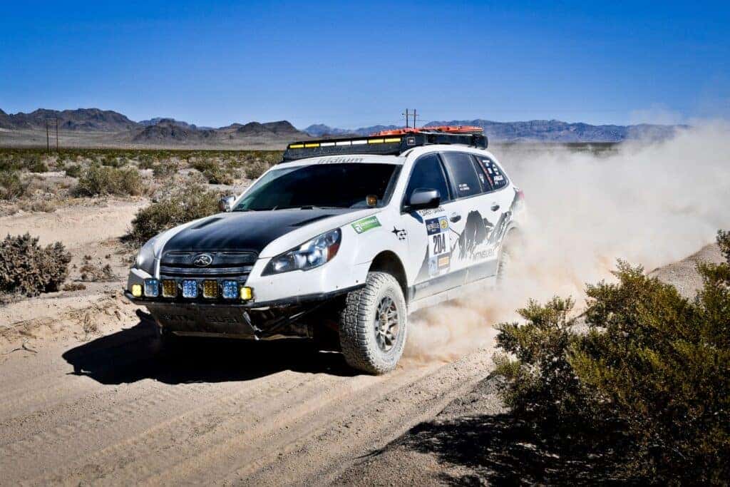 The 2014 Subaru Outback Tracking Dust Clouds As They Race At The 2024 Rebelle Rally