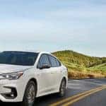 white subaru legacy on road