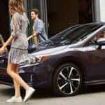 people outside a subaru