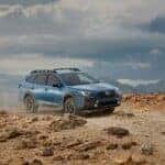 2023 Subaru Outback traversing challenging desert mountain terrain.