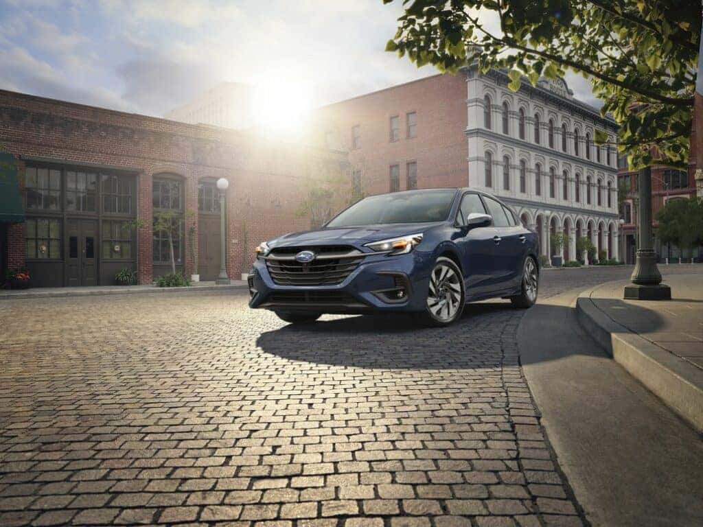 Subaru Legacy Driving on a City Road Front 3/4 View
