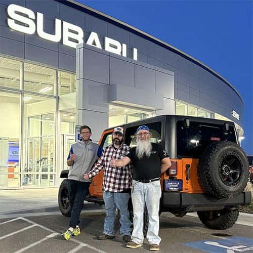 Happy Drivers - Father & Son Duo: Samuel & Kevin of Spring Creek, Nevada with their Crush Orange 2012 Jeep Wrangler Sport