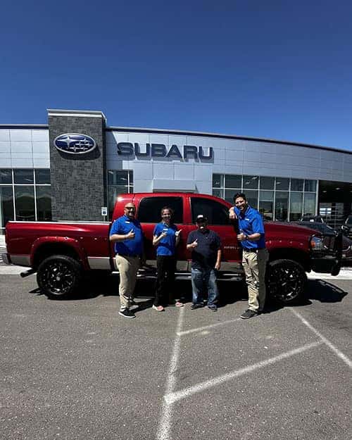 Happy Driver - Ron Haas of Richfield, Idaho - with Michaela Hawley & his new Inferno Red Crystal Pearl 2006 Dodge Ram 2500 SLT Mega Cab