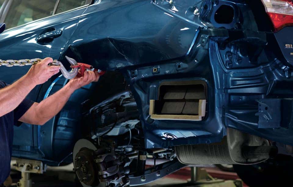 Auto body work on a Subaru that has been in an accident.