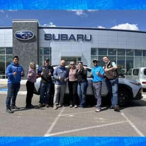 Lori, from Hailey, Idaho, with her Ice Silver Metallic 2024 Subaru Crosstrek Sport in front of Twin Falls Subaru
