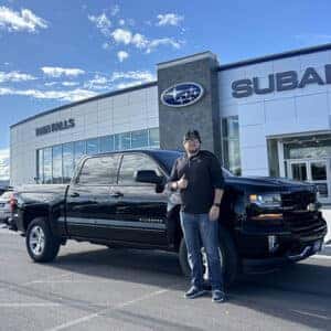 Kaleb from Jerome, Idaho with his Black 2018 Chevy Silverado 1500 LT in front of Twin Falls Subaru