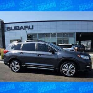 Thomas & Nicole, from Spring Creek, Nevada's used 3-row Magnetite Gray Metallic 2022 Subaru Ascent Limited 7-Passenger in front of Twin Falls, Idaho's #1 Volume Automotive Retailer - Twin Falls Subaru.