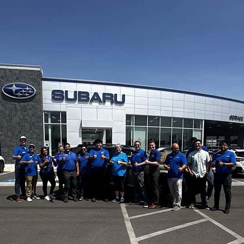 Roseanne, from Jerome, Idaho, with her Autumn Green Metallic 2025 Subaru Forester Premium with Product Specialist Tony Juarez in front of Twin Falls Subaru.