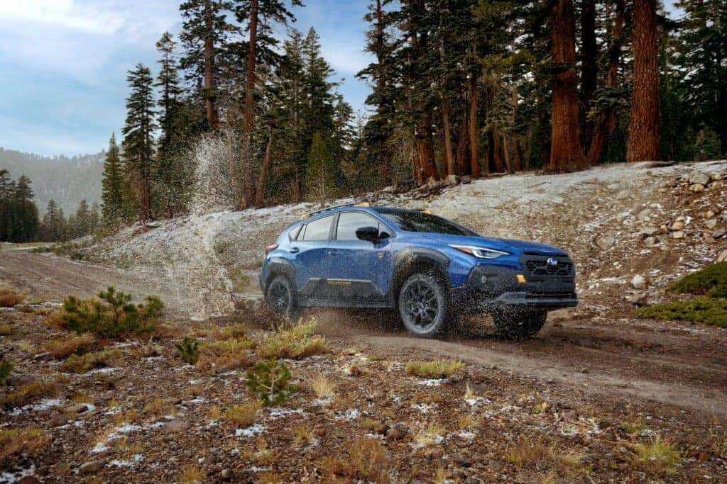 The Powerful 2024 Subaru Crosstrek Wilderness Speeding On A Dirt Road