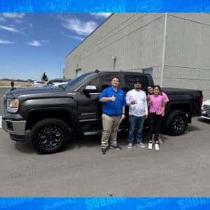 Lanette & Jose, from Rupert, Idaho, with their Iridium Metallic 2014 GMC Sierra SLT, along with Product Specialist Jacob Rudolph outside the Magic Valley's #1 Volume Automotive Retailer - Twin Falls Subaru.