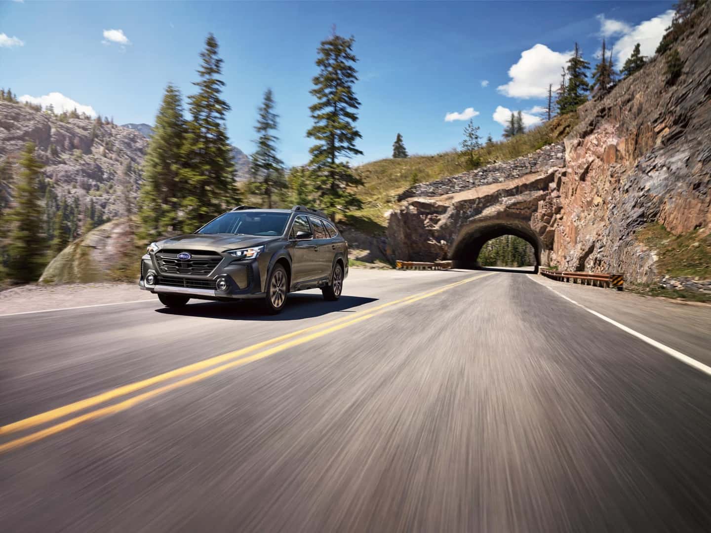 Subaru Outback On the Road in the Mountains
