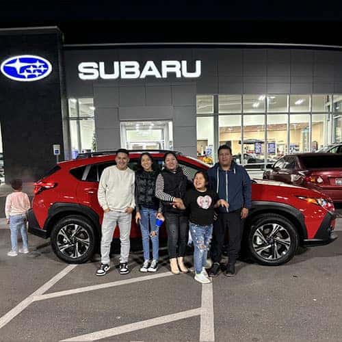 Gissela from Shoshone, Idaho with her Pure Red 2024 Subaru Crosstrek Premium in Twin Falls, Idaho at Twin Falls Subaru, the Magic Valley's #1 Volume Automotive Retailer.