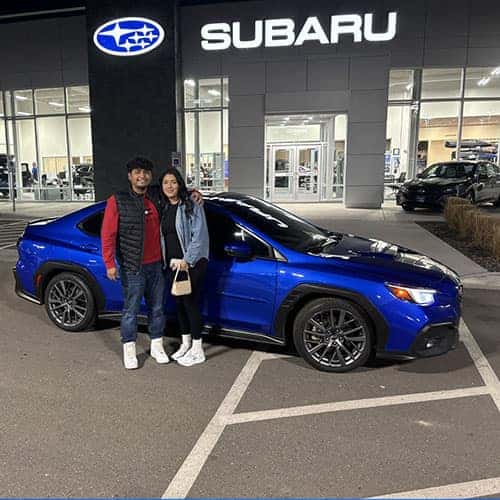 Rupert, Idaho's Julian & Erandy with their World Rally Blue 2022 Subaru WRX GT outside the MVN1VAR Twin Falls Subaru - in Twin Falls, Idaho