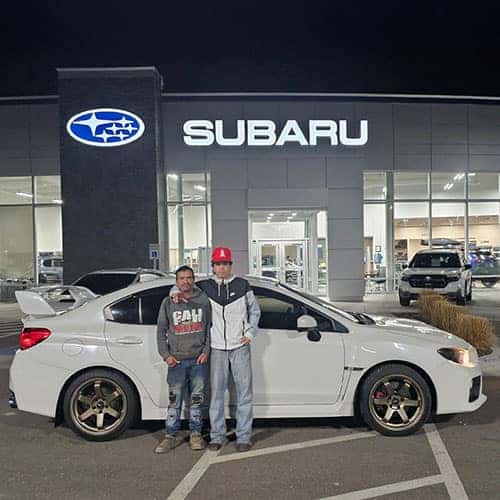 Roberto, from Wendell, Idaho with his Crystal White Pearl 2015 Subaru WRX in front of Twin Falls Subaru in Twin Falls, Idaho