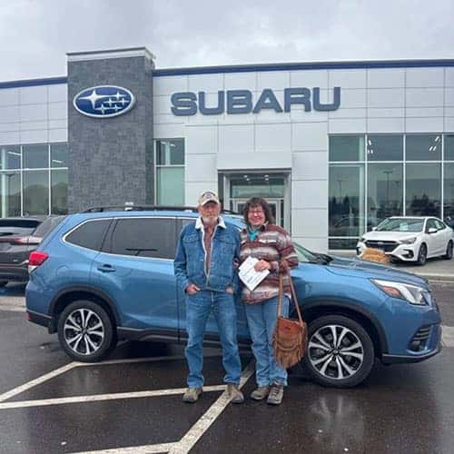 Connie & Glenn from Burley, Idaho with their Subaru Certified Pre-Owned Horizon Blue Pearl 2024 Subaru Forester Limited outside of Twin Falls, Idaho's own Twin Falls Subaru