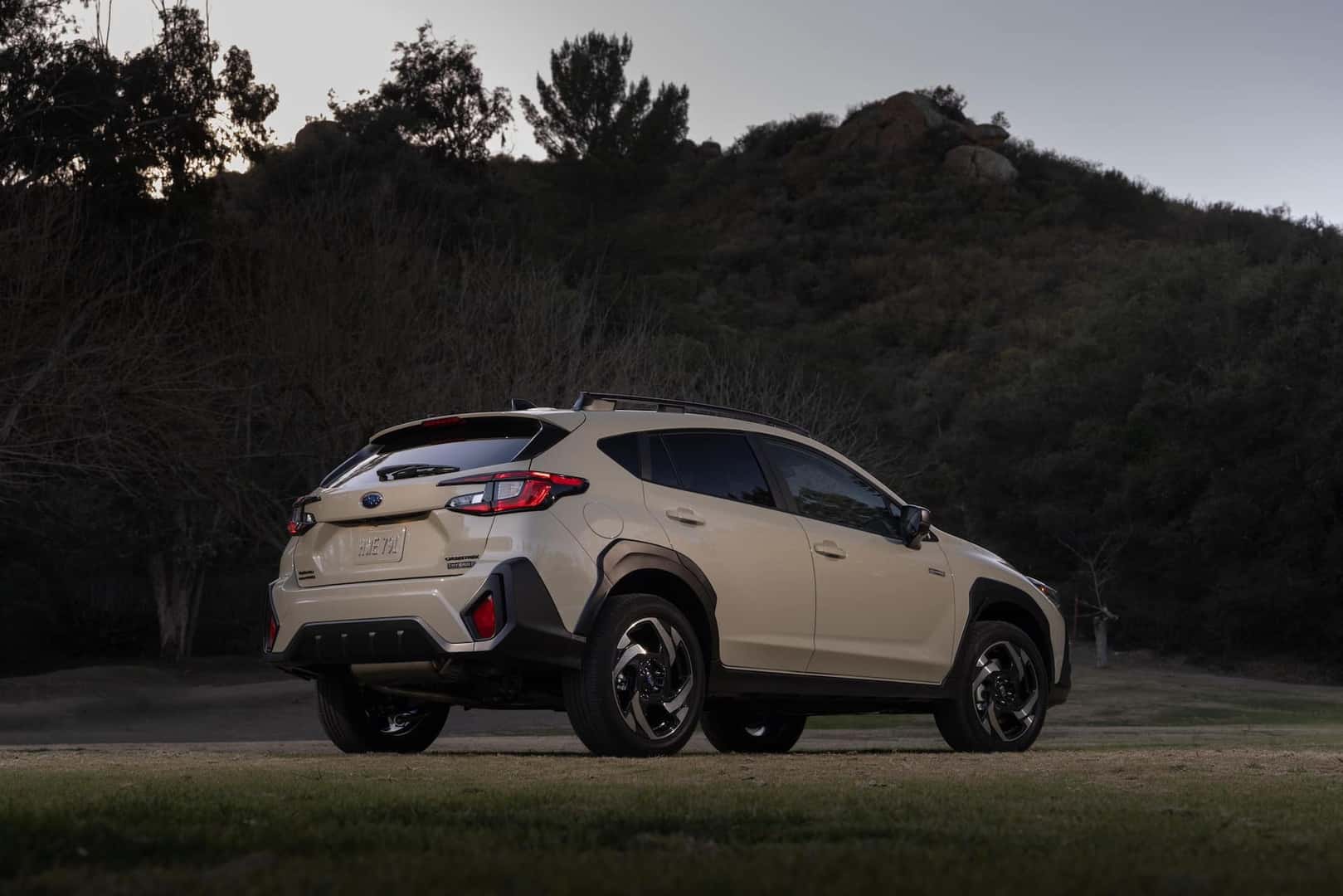 2026 Subaru Crosstrek Hybrid Sand Dune Pearl rear and passenger side view