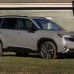 A Comfortable And Safe 2025 Subaru Forester Outside An Older Adult's Home