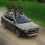 The Dependable And Highly Rated Subaru Outback, With Two Bikes On Its Roof
