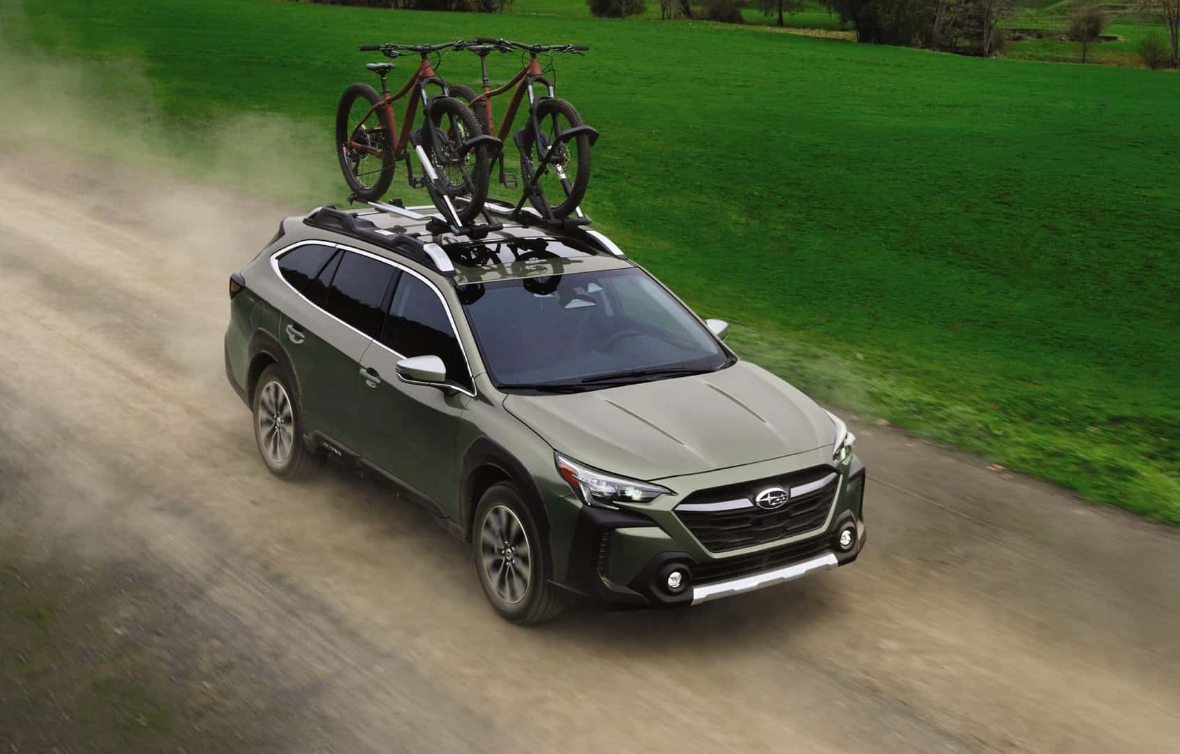 The Dependable And Highly Rated Subaru Outback, With Two Bikes On Its Roof