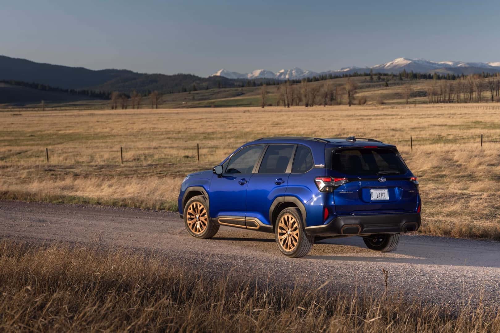 2025 Subaru Forester Sapphire Blue Pearl on gravel road