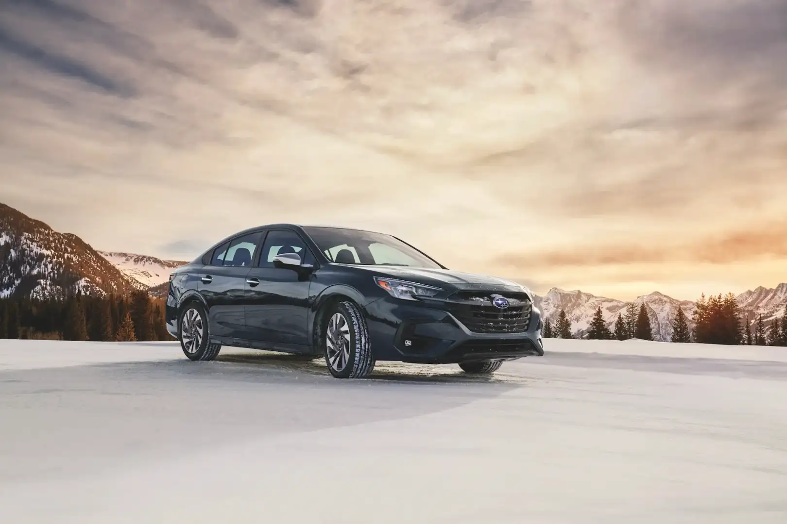 2025 Grey Subaru Legacy in front of Mountains and Trees