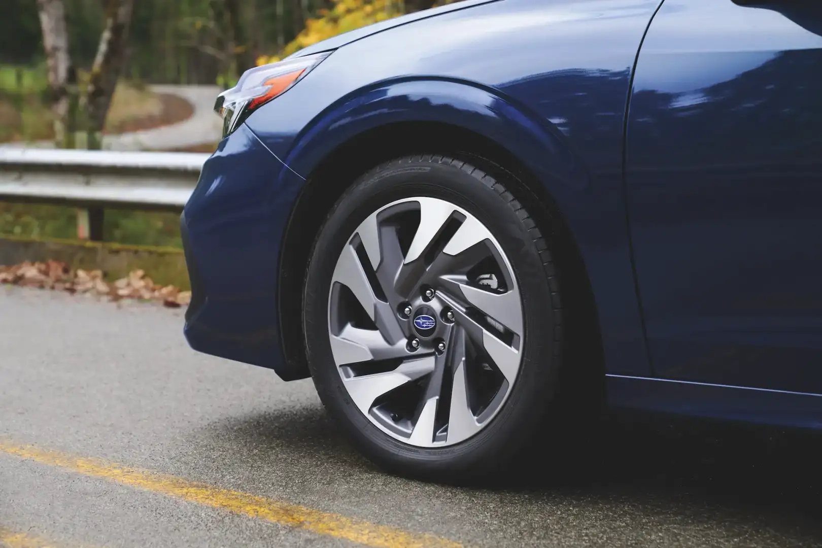 2025 blue Subaru Legacy front wheel on road