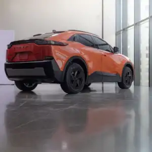 2026 Subaru Uncharted Habanero Orange Metallic rear and side view