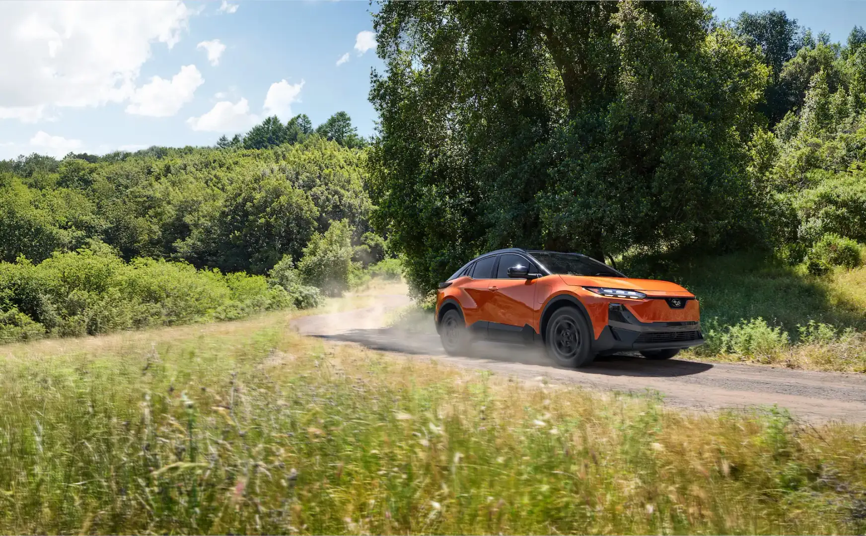 2026 Subaru Uncharted Habanero Orange Metallic in motion