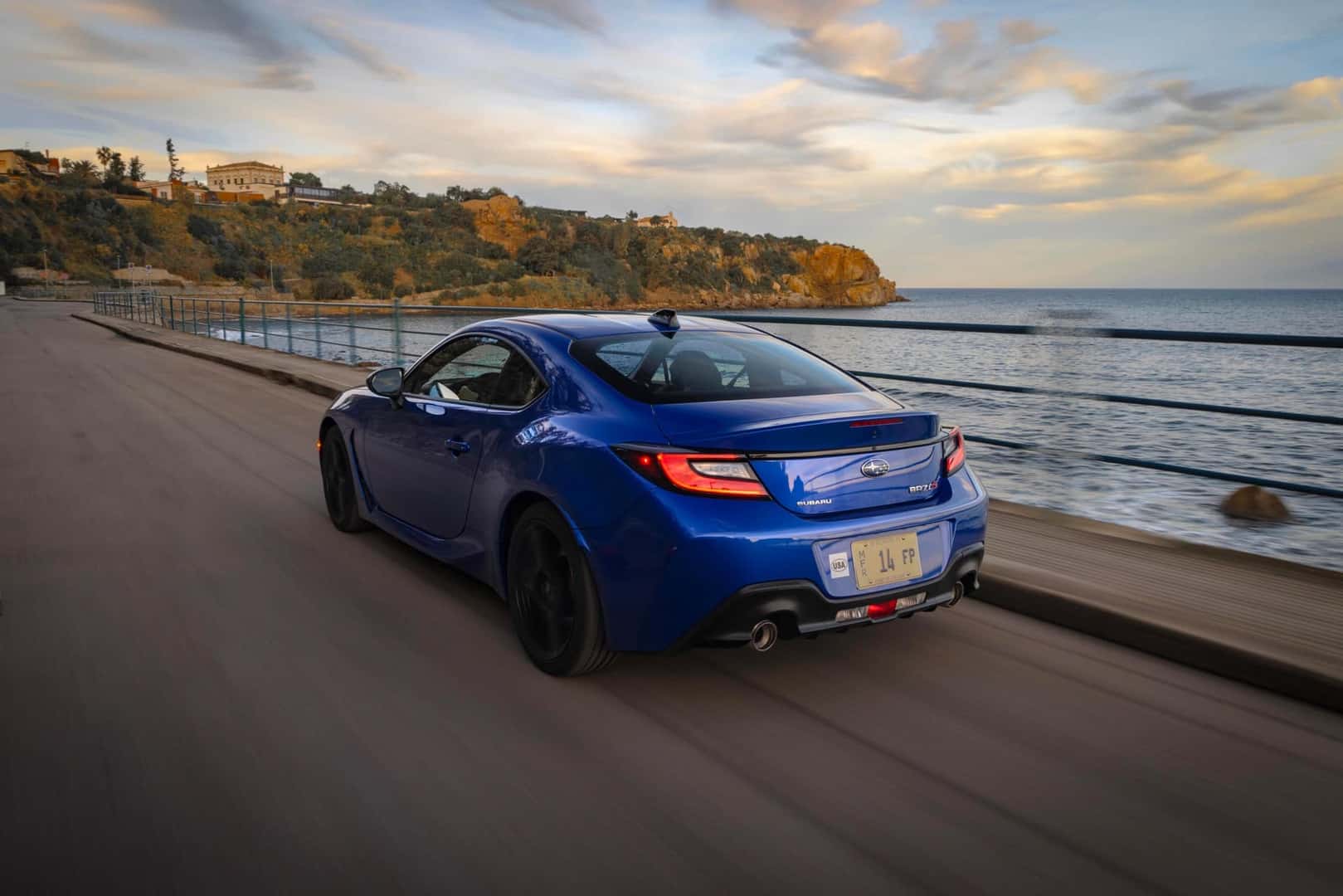 The Swift And Adventurous Subaru BRZ, Driving Fast On A Bridge Towards An Island
