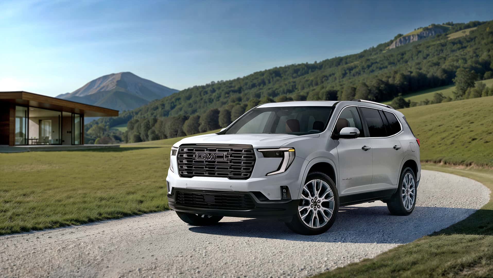 2026_GMC_Acadia_in_front_of_mountain