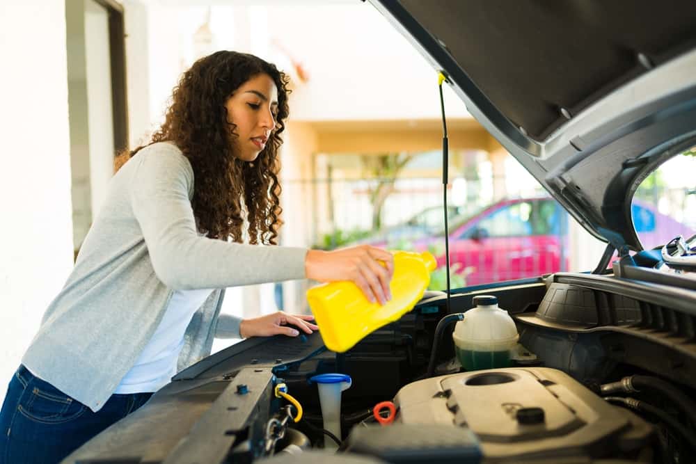 Woman using synthetic oil vs. conventional oil