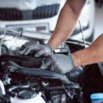 Car Mechanic Fixing a Vehicle