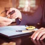 Car Salesperson Holding Keys Car Buying Concept