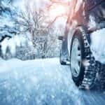 Car Traveling on Snowy Road
