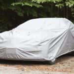 Car covered in tarp for storage
