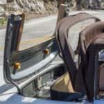Convertible top folding into a car