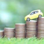 Depreciation Concept Car on Stack of Coins