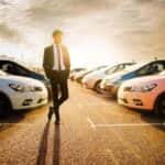 Handsome well dressed man shopping for a new vehicle