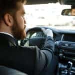 Man Driving Car to Work
