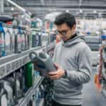 Man buying new motor oil