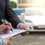 Man filling out financial form